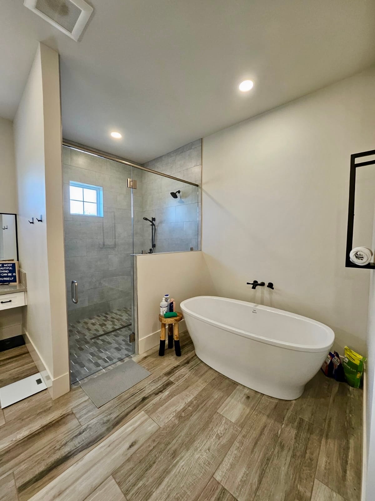 Sparkling bathroom with freestanding tub and glass shower