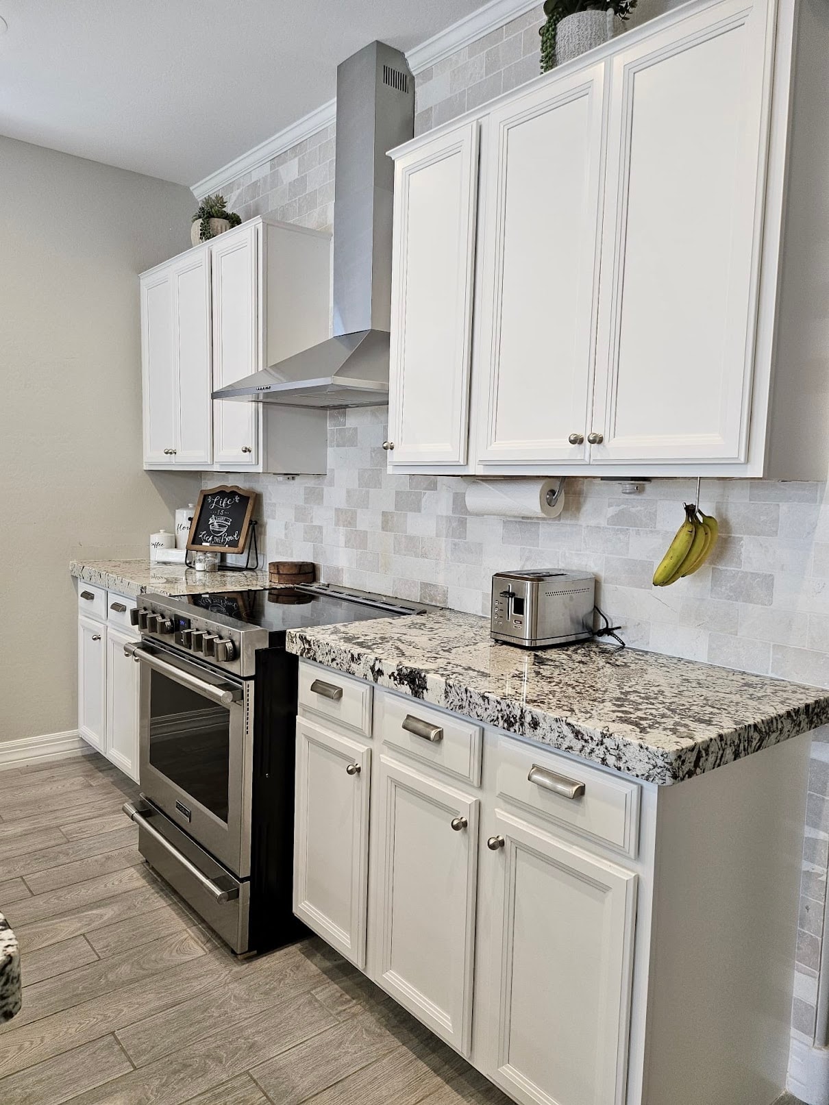 Gleaming white kitchen cabinets and stainless appliances